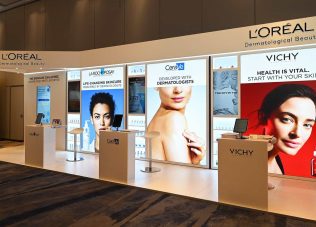 Skincare brand displays at a professional exhibition booth.