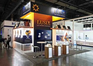 Exhibition booth showcasing Luxix sun-grown diamonds at trade show.