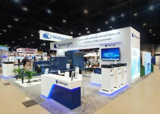 Watergen booth showcasing sustainable water solutions at trade exhibition.